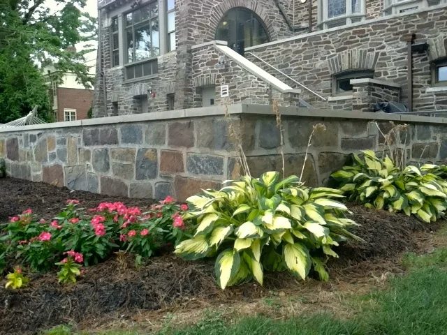 Stone retaining walls and planting beds at the Cannon Club terrace
